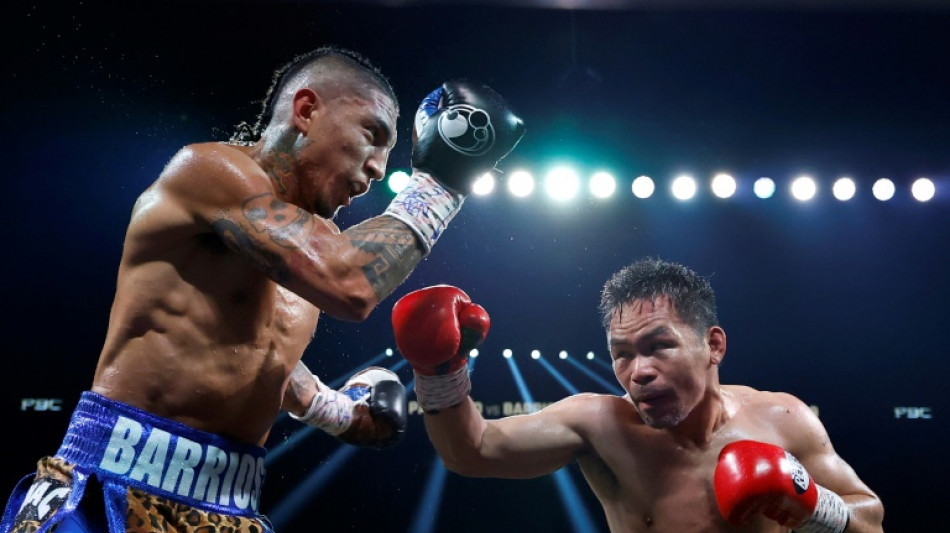 Pacquiao held to draw by Barrios in world title return