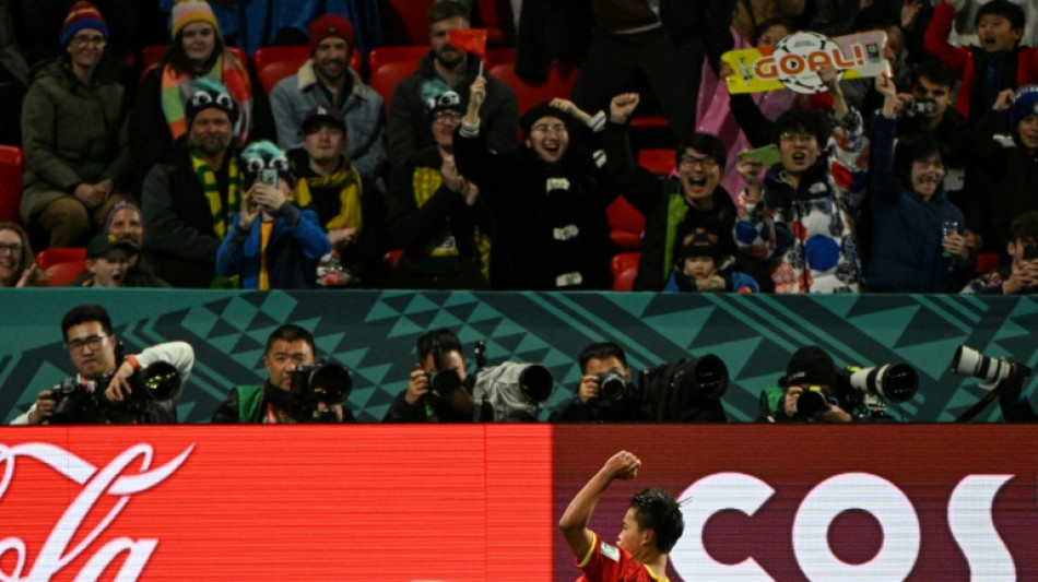 Ten-player China beat Haiti to stay alive after wild World Cup clash