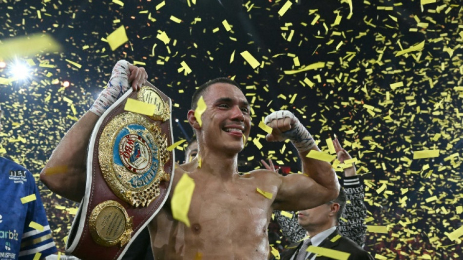 Australian Tszyu takes title with 9th round TKO