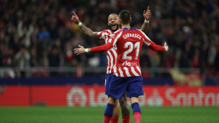 Atletico thrash Sevilla, celebrate Simeone record in style
