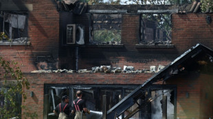 In town hit by wildfire, PM says UK must 'face up to climate change'
