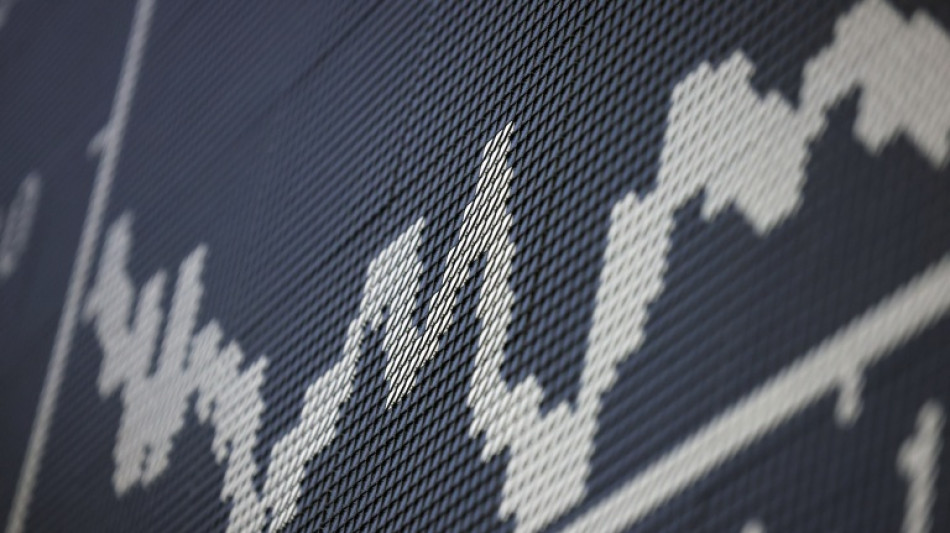 Stock markets mixed ahead of tech earnings, central bank decisions