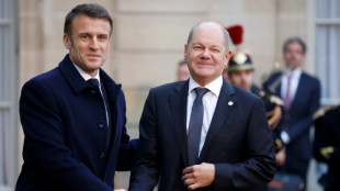 Macron re&ccedil;oit Scholz pour un d&eacute;jeuner en forme d'au revoir