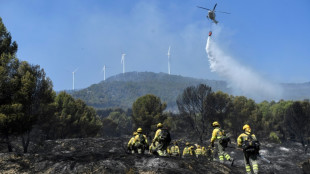 Spain fights fierce fire fanned by winds