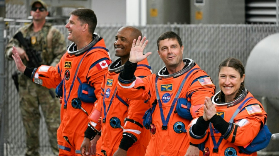 Astronauts strapped in for historic US lunar launch