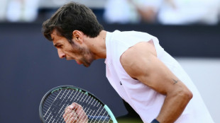 Musetti battles Medvedev and match-point rain delay to reach Rome quarters