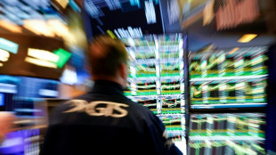 Wall Street ouvre en baisse, prudente face aux droits de douane et &agrave; la Fed