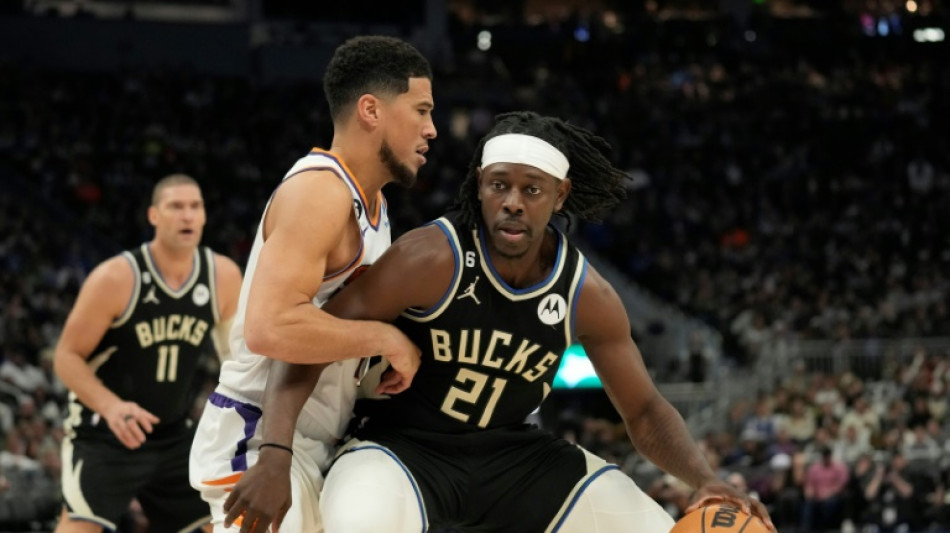 Short-handed Bucks edge Suns to push NBA win streak to 14